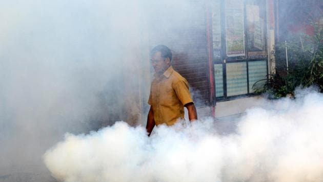 Ulhasnagar Municipal Corporation staff use a fogging machine to prevent the breeding of mosquitos in order to prevent spread of malaria, dengue and brain fever.(HT Photo)