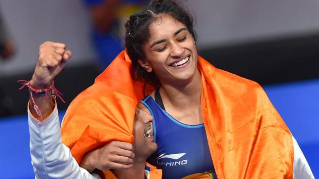 Vinesh Phogat celebrates after winning the Gold medal in women's freestyle 50 kg wrestling at the Asian Games 2018.(PTI)