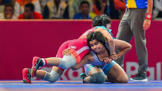 India's Divya Kakran (blue) during her 68 kg freestyle wrestling match against Mongolia’s Tumentsetseg Sharkhuu at the Asian Games 2018.(PTI)