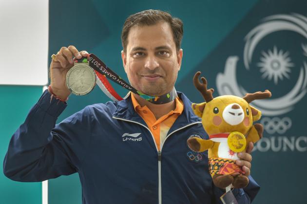 Palembang: Silver medal winners shooter Sanjeev Rajput poses for photographs at the medal ceremony of men's 50m rifle 3 position shooting at the 18th Asian Games 2018 at Palembang in Indonesia on Tuesday, Aug 21, 2018. (PTI Photo/Vijay Verma) (PTI8_21_2018_000054B) (PTI) Palembang: Silver medal winners shooter Sanjeev Rajput poses for photographs at the medal ceremony of men's 50m rifle 3 position shooting at the 18th Asian Games 2018 at Palembang in Indonesia on Tuesday, Aug 21, 2018. (PTI Photo/Vijay Verma) (PTI8_21_2018_000054B) (PTI)