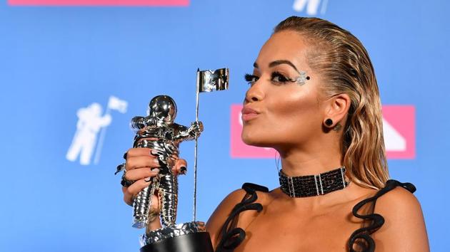 British singer Rita Ora poses with her award for Best Dance.   (AFP) 