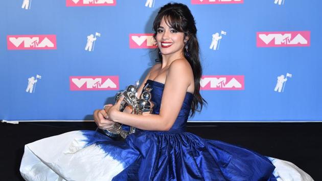 US/Cuban singer/songwriter Camila Cabello holds her 2 awards for Video of the Year and Artist of the Year.  (AFP) 