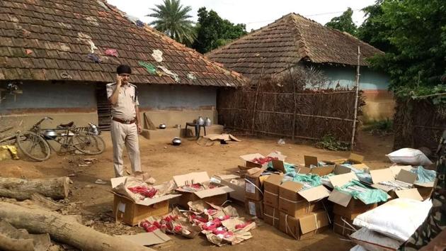 Police officials inspecting explosives seized at Shahpur village in Pakur district on Monday, August 20, 2018.