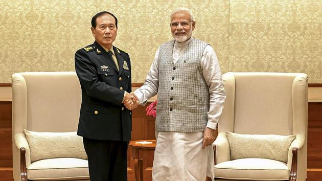 Prime Minister Narendra Modi shakes hands with defence minister of China, General Wei Fenghe during a meeting in New Delhi on August 21.(PTI Photo)