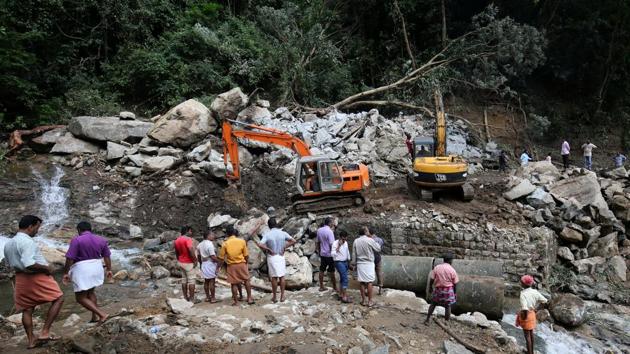 A Public Works Department machine repairs a collapsed bridge after floods at Nelliyampathy Village, in Kerala. (REUTERS) A Public Works Department machine repairs a collapsed bridge after floods at Nelliyampathy Village, in Kerala. (REUTERS)