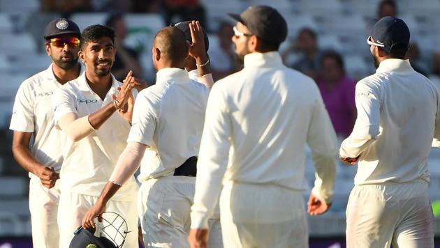 India's Jasprit Bumrah (2L) celebrates with teammates the wicket of England's Stuart Broad for 20 during the fourth day of the third Test cricket match between England and India at Trent Bridge in Nottingham, central England on August 21, 2018.(AFP)