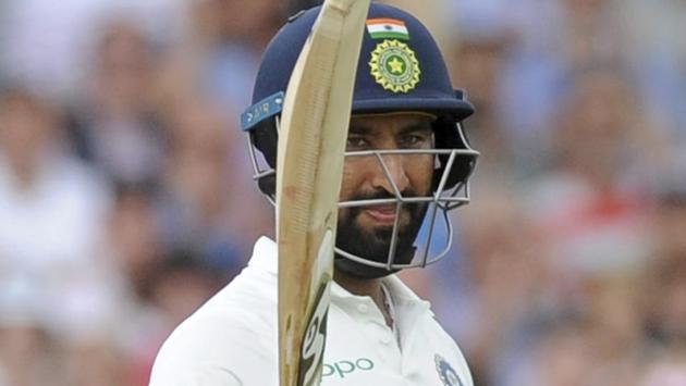 India's Cheteshwar Pujara celebrates after scoring his half century. (AP)