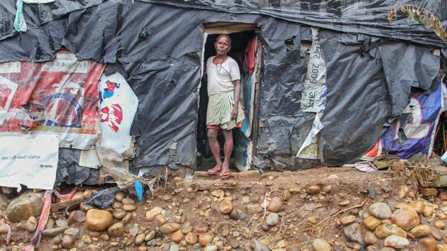 A man looks from his shanty in a flash-floods affected area of Kalka Colony in Jammu. (PTI) A man looks from his shanty in a flash-floods affected area of Kalka Colony in Jammu. (PTI)