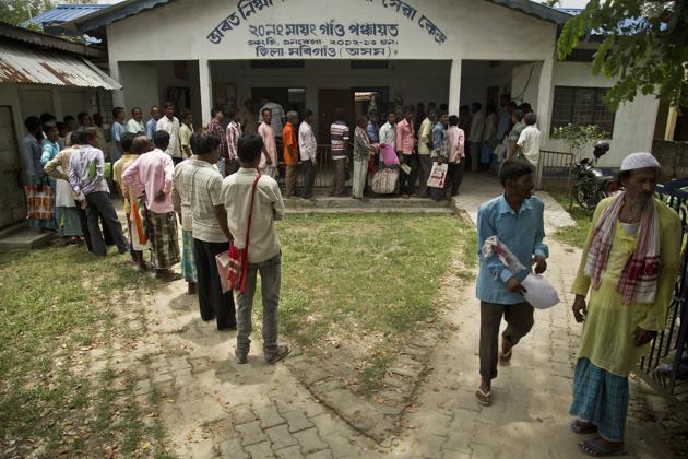 People whose name were left out in the NRC draft stand in a queue to collect forms to file appeals in Mayong, 45 kilometers east of Guwahati on August 10.(AP File Photo) People whose name were left out in the NRC draft stand in a queue to collect forms to file appeals in Mayong, 45 kilometers east of Guwahati on August 10.(AP File Photo)