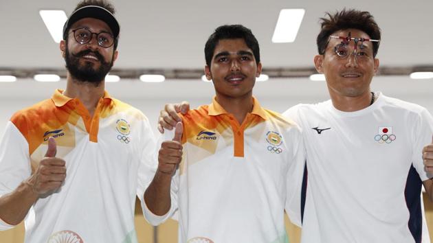 Saurabh Chaudhary (C) and Abhishek Verma (L) won gold and bronze respectively at Asian Games 2018 on Tuesday.(REUTERS)
