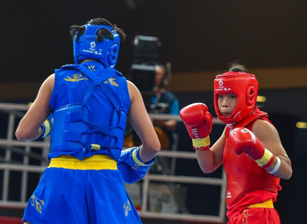 India's Naorem Roshibina Devi (red) fights China's Cai Yingying during the Wushu - Women's Sanda - 60kg event at the Asian Games 2018 (PTI) India's Naorem Roshibina Devi (red) fights China's Cai Yingying during the Wushu - Women's Sanda - 60kg event at the Asian Games 2018 (PTI)