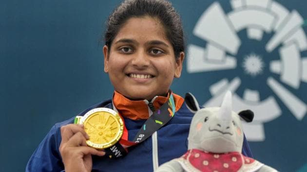 Gold medalist shooter Rahi Sarnobat poses for photographs after the presentation ceremony of women's 25m pistol event during the 18th Asian Games at Palembang. (PTI)