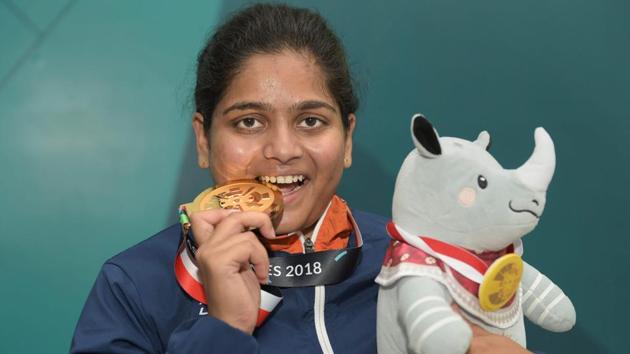 Gold medalist shooter Rahi Sarnobat poses for photograph after the presentation ceremony of women's 25m pistol event during the 18th Asian Games.(PTI)