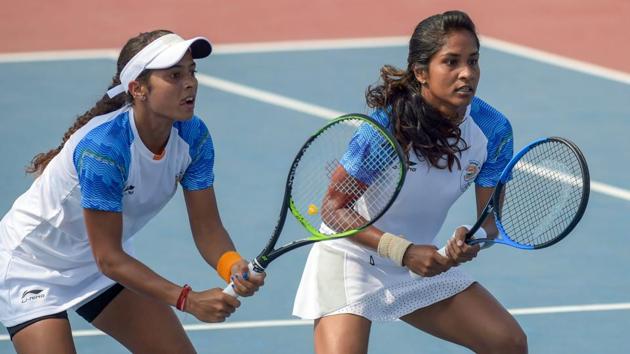 Indian tennis players Ankita Raina and Prarthna Thombare play against Kazakhstan's Gozal Ainitdinova and Anna Danilina during women's doubles R16 match at the 18th Asian Games at Palembang. (PTI) Indian tennis players Ankita Raina and Prarthna Thombare play against Kazakhstan's Gozal Ainitdinova and Anna Danilina during women's doubles R16 match at the 18th Asian Games at Palembang. (PTI)