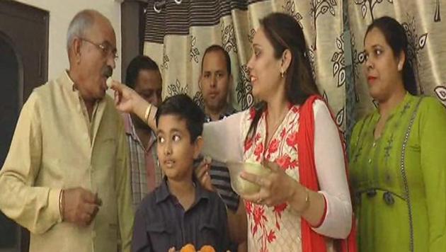 Relatives offering sweets to Sanjeev Rajput’s father KL Rajput at his house in Jagadhri, Yamunanagar, on Tuesday. (HT Photo) Relatives offering sweets to Sanjeev Rajput’s father KL Rajput at his house in Jagadhri, Yamunanagar, on Tuesday. (HT Photo)