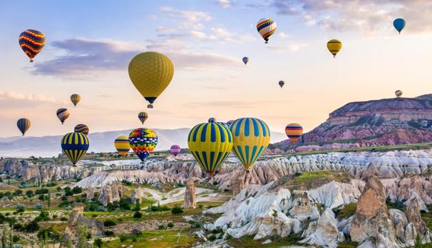 Cappadocia, Turkey: If you are on cloud nine, then it calls for a hot-air baloon proposal at Cappadocia. The ride is romantic and offers views of the region’s fairy chimneys, hills and boulders. (Shutterstock) Cappadocia, Turkey: If you are on cloud nine, then it calls for a hot-air baloon proposal at Cappadocia. The ride is romantic and offers views of the region’s fairy chimneys, hills and boulders. (Shutterstock)