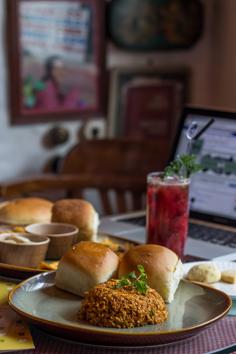 Soft scrambled eggs always taste better with dollops of butter. Add masala, fried onion and tomato, and you get akuri. Eat fresh, with warm pav, as served at SodaBottleOpenerWala.