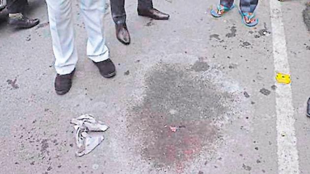 A resident points to the spot where two bikers threw acid on a 32 yearold woman in Ghaziabad on Monday. (Sakib Ali/ HT Photo) A resident points to the spot where two bikers threw acid on a 32 yearold woman in Ghaziabad on Monday. (Sakib Ali/ HT Photo)