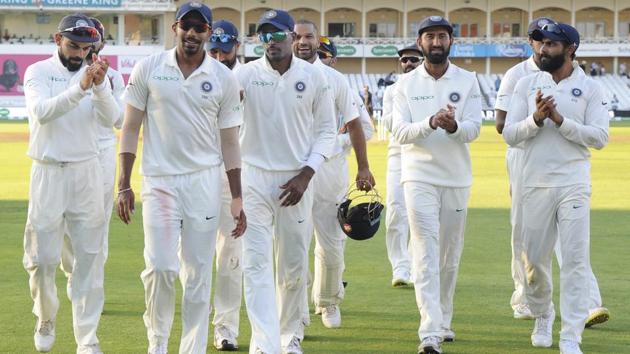 Indian cricketers applaud Jasprit Bumrah, front, who took five wickets, as they walk back to the pavilion. (AP) Indian cricketers applaud Jasprit Bumrah, front, who took five wickets, as they walk back to the pavilion. (AP)
