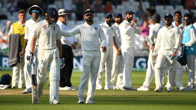 England's Jos Buttler (L) is greeted by India's captain Virat Kohli (C) as he leaves the pitch after losing his wicket. (AFP) England's Jos Buttler (L) is greeted by India's captain Virat Kohli (C) as he leaves the pitch after losing his wicket. (AFP)