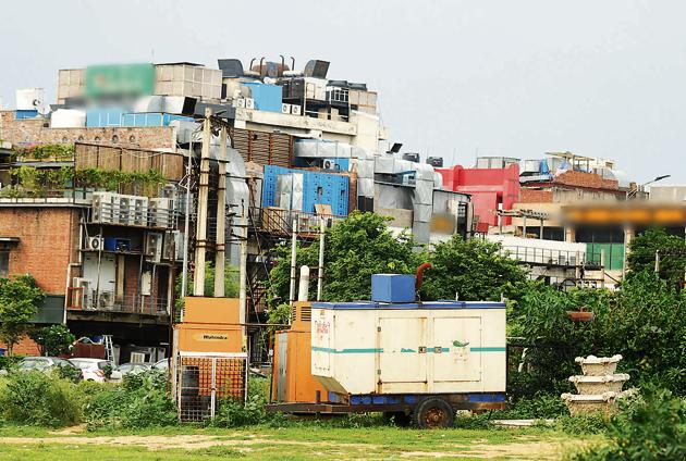 A visit to the market on Wednesday revealed that eateries, pubs and hotels have installed heavy-duty generators in HSVP’s green belts or on public space, a designated green belt. (Parveen Kumar/HT Photo) A visit to the market on Wednesday revealed that eateries, pubs and hotels have installed heavy-duty generators in HSVP’s green belts or on public space, a designated green belt. (Parveen Kumar/HT Photo)