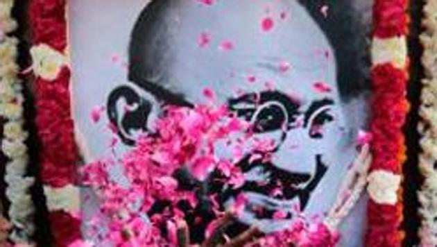 School children pay homage to a portrait of Mahatma Gandhi on his 70th Death Anniversary, in Chennai. (PTI File Photo) School children pay homage to a portrait of Mahatma Gandhi on his 70th Death Anniversary, in Chennai. (PTI File Photo)