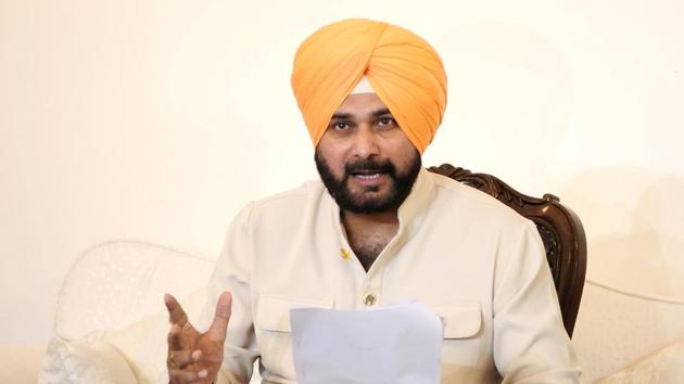 Punjab cabinet minister Navjot Singh Sidhu gestures during a press conference in Chandigarh on August 21.(HT Photo)