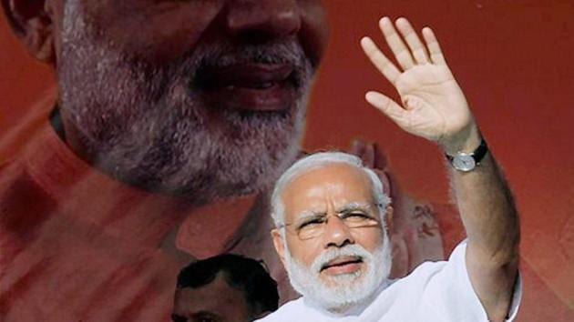 Prime Minister Narendra Modi waves to the gathering during his visit to Gujarat's Somnath Temple. (PTI File Photo) Prime Minister Narendra Modi waves to the gathering during his visit to Gujarat's Somnath Temple. (PTI File Photo)