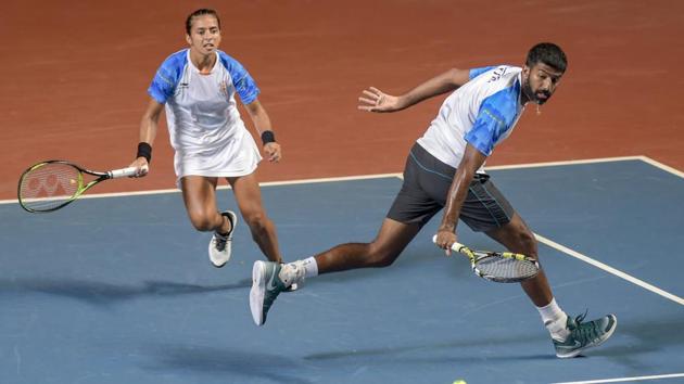 Indian tennis players Rohan Bopanna and Ankita Raina play against Indonesian pair Aldila Sutjiadi and Christopher Benjamin Rungkat. (PTI) Indian tennis players Rohan Bopanna and Ankita Raina play against Indonesian pair Aldila Sutjiadi and Christopher Benjamin Rungkat. (PTI)