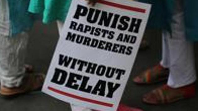 FILE - In this April 15, 2018 file photo, an Indian protestor stands with a placard during a protest against two recently reported rape cases as they gather near the Indian parliament in New Delhi.(AP) FILE - In this April 15, 2018 file photo, an Indian protestor stands with a placard during a protest against two recently reported rape cases as they gather near the Indian parliament in New Delhi.(AP)