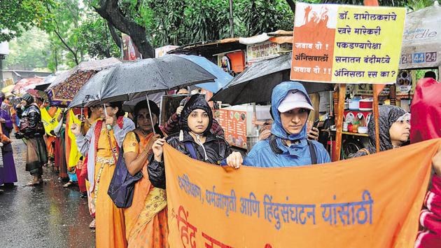 Hindu Janajagruti Samiti and Sanatan Sanstha members organised a march to protest the arrests made in the Narendra Dabholkar case. The march was held from Maharana Pratap garden to Kasba Ganpati temple on Tuesday. (RAVINDRA JOSHI/HT PHOTO) Hindu Janajagruti Samiti and Sanatan Sanstha members organised a march to protest the arrests made in the Narendra Dabholkar case. The march was held from Maharana Pratap garden to Kasba Ganpati temple on Tuesday. (RAVINDRA JOSHI/HT PHOTO)