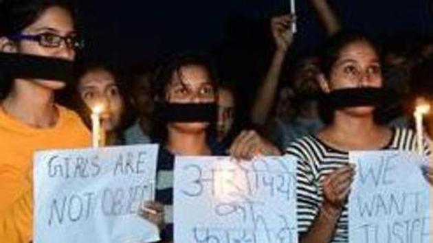 A candle light march in Bikaner to protest the rape of an eight-year-old girl in MP’s Mandsaur, June 30, 2018. (PTI File Photo) A candle light march in Bikaner to protest the rape of an eight-year-old girl in MP’s Mandsaur, June 30, 2018. (PTI File Photo)