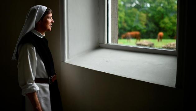 Sister Angela Finegan looks out of the church window at St Mary’s Abbey in Glencairn, Ireland. “I am so excited about the day, to be in the presence of this good and holy leader of our Church... It will be a great joy and blessing. Especially in the days when the presence of God and the life of the Church are hidden in our fast-paced society,” said Sister Angela. (Clodagh Kilcoyne / REUTERS) Sister Angela Finegan looks out of the church window at St Mary’s Abbey in Glencairn, Ireland. “I am so excited about the day, to be in the presence of this good and holy leader of our Church... It will be a great joy and blessing. Especially in the days when the presence of God and the life of the Church are hidden in our fast-paced society,” said Sister Angela. (Clodagh Kilcoyne / REUTERS)
