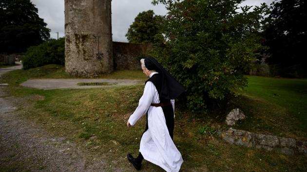 Sister Marie Fahy walks through the farm in St Mary's Abbey. The proportion of Catholics fell to 78% in the most recent census of 2016 from a peak of 95% in 1961. Many of those no longer practice, as seen by dwindling mass attendances and the fact that only half of all marriages last year were Catholic ceremonies compared to over 90% 20 years ago. (Clodagh Kilcoyne / REUTERS) Sister Marie Fahy walks through the farm in St Mary's Abbey. The proportion of Catholics fell to 78% in the most recent census of 2016 from a peak of 95% in 1961. Many of those no longer practice, as seen by dwindling mass attendances and the fact that only half of all marriages last year were Catholic ceremonies compared to over 90% 20 years ago. (Clodagh Kilcoyne / REUTERS)