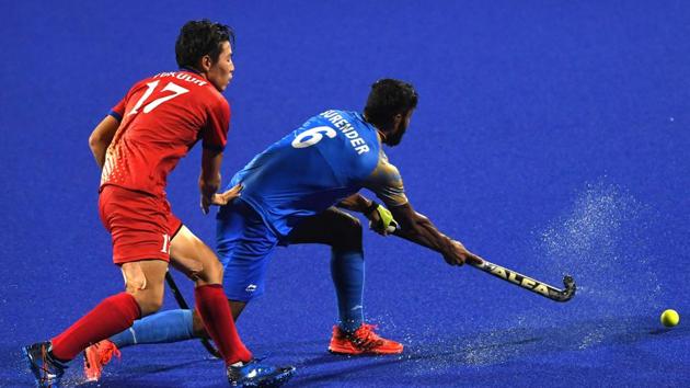 India's Surender Kumar (R) and Japan's Kentaro Fukuda (L) compete for the ball during the men's hockey pool B match between India and Japan. (AFP) India's Surender Kumar (R) and Japan's Kentaro Fukuda (L) compete for the ball during the men's hockey pool B match between India and Japan. (AFP)