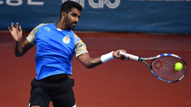 India's Prajnesh Gunneswaran plays a shot against Uzbekistan's Denis Istomin during their men's singles semi-final tennis match (AFP) India's Prajnesh Gunneswaran plays a shot against Uzbekistan's Denis Istomin during their men's singles semi-final tennis match (AFP)