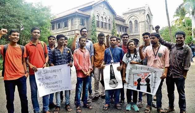 Students, including some affiliated to the National Students’ Union of India and Janata Dal (United), stage a protest against Satyanarayan Puja organised on Fergusson College campus on Friday. (HT Photo) Students, including some affiliated to the National Students’ Union of India and Janata Dal (United), stage a protest against Satyanarayan Puja organised on Fergusson College campus on Friday. (HT Photo)