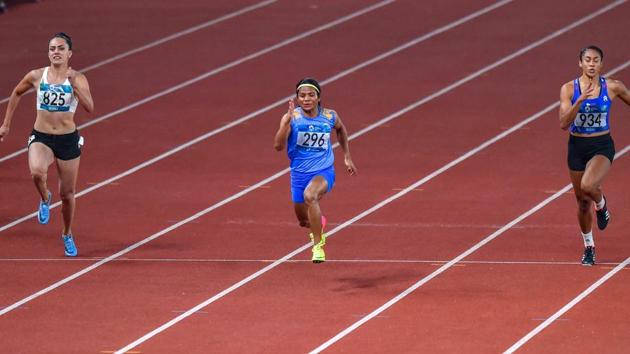 India's Dutee Chand (C) competes in the 100m women's heat during the athletics competition. (PTI)