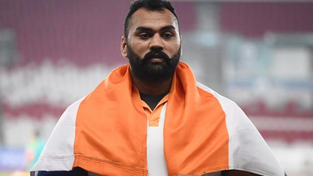 Gold medallist India's Tajinderpal Toor celebrates during the victory ceremony for the men's shot put athletics event during the 2018 Asian Games in Jakarta on August 25, 2018.(AFP)