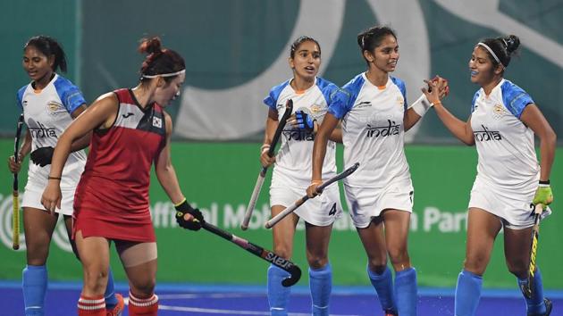 India players celebrate after scoring a goal during the women's hockey pool B match between India and South Korea. (AFP)