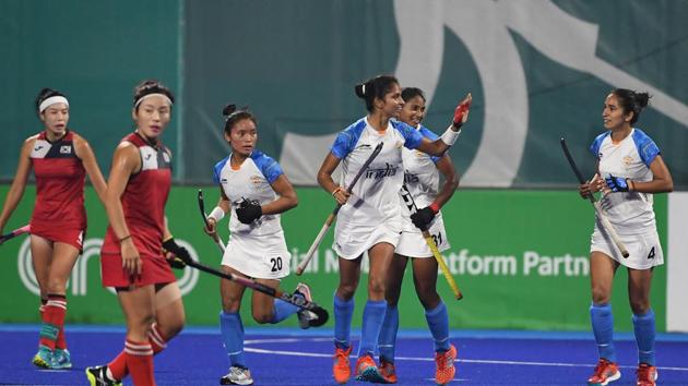 India players celebrate after scoring a goal during the women's hockey pool B match between India and South Korea at the 2018 Asian Games in Jakarta.(AFP)