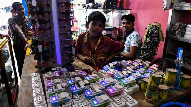 At the Kutupalong megacamp Bangladeshi entrepreneur Kamal Hussein, 24, is praying for rain. His income comes from a row of nearly 50 mobile phone charging points secured by bamboo struts. “Business is slow... it is sunny and most people have solar panels so they don’t need our shop,” he said. Business is better when it rains because then “the solar panels don’t work”, he adds (Chandan Khanna / AFP) At the Kutupalong megacamp Bangladeshi entrepreneur Kamal Hussein, 24, is praying for rain. His income comes from a row of nearly 50 mobile phone charging points secured by bamboo struts. “Business is slow... it is sunny and most people have solar panels so they don’t need our shop,” he said. Business is better when it rains because then “the solar panels don’t work”, he adds (Chandan Khanna / AFP)