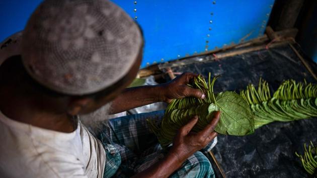 A Rohingya refugee sorts leaves to sell for chewing paan in the Kutupalong camp. Poorer Bangladeshis say the Rohingya influx has collapsed wages. Crime, drugs and prostitution are rising, while the foreign NGO influx has warped prices -- making owners of apartments, cars, hotels and restaurants richer, but sharpening the poverty of the locals with nothing to offer them. (Chandan Khanna / AFP) A Rohingya refugee sorts leaves to sell for chewing paan in the Kutupalong camp. Poorer Bangladeshis say the Rohingya influx has collapsed wages. Crime, drugs and prostitution are rising, while the foreign NGO influx has warped prices -- making owners of apartments, cars, hotels and restaurants richer, but sharpening the poverty of the locals with nothing to offer them. (Chandan Khanna / AFP)