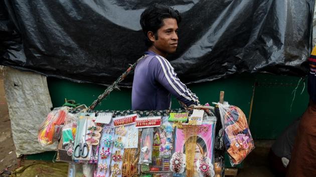 Stores to repair and pawn Rohingya jewellery, stalls selling saris and shops charging refugees 30 US cents to watch live English Premier League football matches on their TVs have sprung up around the camp fringes over the past year. Furthermore, the non-profits which work in the camps are big buyers of local bamboo, tarpaulins, concrete, pots, pans and blankets and employ thousands of Bangladeshi and Rohingya staff. (Chanddan Khanna / AFP) Stores to repair and pawn Rohingya jewellery, stalls selling saris and shops charging refugees 30 US cents to watch live English Premier League football matches on their TVs have sprung up around the camp fringes over the past year. Furthermore, the non-profits which work in the camps are big buyers of local bamboo, tarpaulins, concrete, pots, pans and blankets and employ thousands of Bangladeshi and Rohingya staff. (Chanddan Khanna / AFP)
