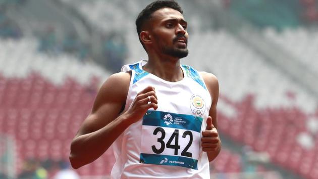 India's Muhammed Anas Yahiya crosses the finish line to win his men's 400m heat at the Asian Games 2018.(AP)