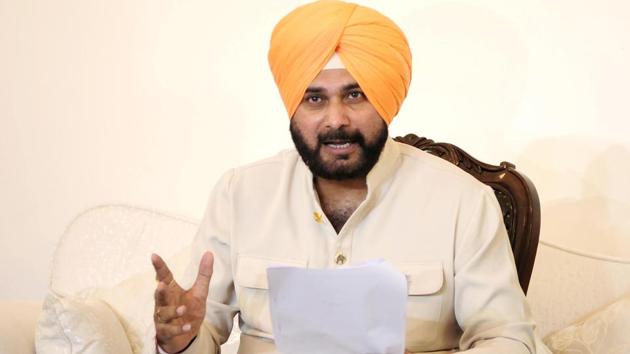 Punjab cabinet minister Navjot Singh Sidhu gestures during a press conference after furore over his hugging the Pakistan Army chief during his participation in Imran Khan’s oath-taking ceremony, on August 21, 2018 in Chandigarh, Punjab. (Keshav Singh / HT Photo) Punjab cabinet minister Navjot Singh Sidhu gestures during a press conference after furore over his hugging the Pakistan Army chief during his participation in Imran Khan’s oath-taking ceremony, on August 21, 2018 in Chandigarh, Punjab. (Keshav Singh / HT Photo)
