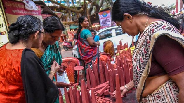 A vendor selling ‘Thrikkakara Appan’, the most important of Onam celebration at Kochi in Kerala on Friday. (PTI Photo) A vendor selling ‘Thrikkakara Appan’, the most important of Onam celebration at Kochi in Kerala on Friday. (PTI Photo)