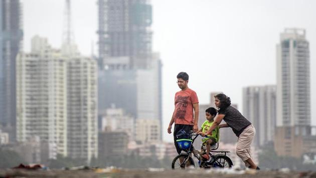 A father and mother help their son to ride a bicycle at Dadar chowpatty on August 20, 2018 in Mumbai, Maharashtra. (Pratik Chorge / HT Photo) A father and mother help their son to ride a bicycle at Dadar chowpatty on August 20, 2018 in Mumbai, Maharashtra. (Pratik Chorge / HT Photo)