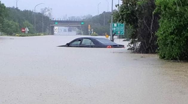 Six people died from heavy rains that have lashed Taiwan for two days, causing widespread flooding and forcing evacuations of thousands. (AFP Photo) Six people died from heavy rains that have lashed Taiwan for two days, causing widespread flooding and forcing evacuations of thousands. (AFP Photo)