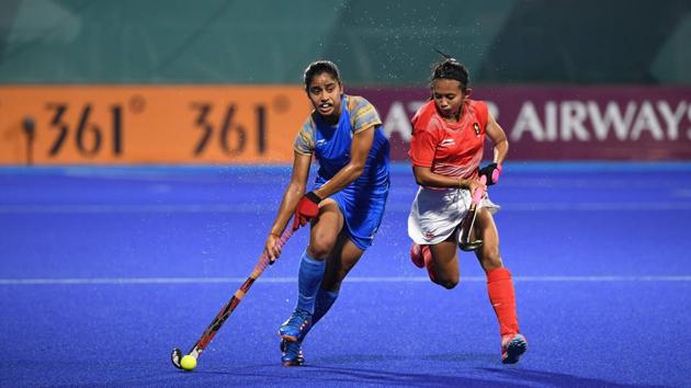 India’s Reena Khokhar (L) runs with the ball past Indonesia's Yuanita Suwito during the women’s hockey pool B match between India and Indonesia at the 2018 Asian Games in Jakarta on August 19, 2018. (Punit Paranjpe / AFP) India’s Reena Khokhar (L) runs with the ball past Indonesia's Yuanita Suwito during the women’s hockey pool B match between India and Indonesia at the 2018 Asian Games in Jakarta on August 19, 2018. (Punit Paranjpe / AFP)